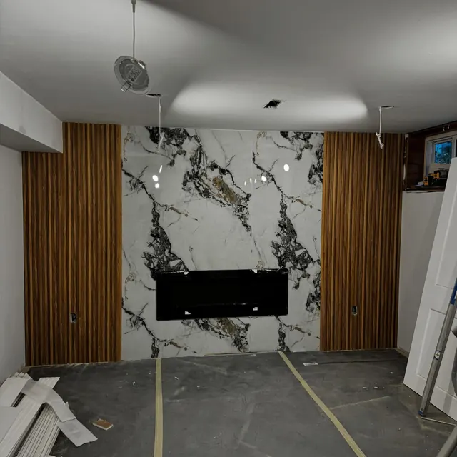 A stone feature wall being set out during construction.