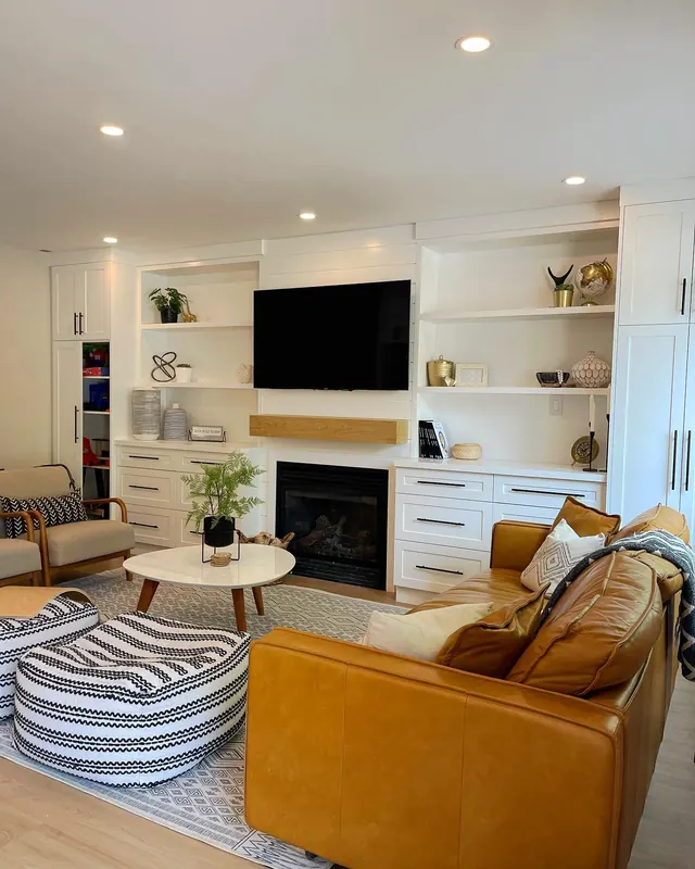 Living room with built-in joinery flanking the fireplace.