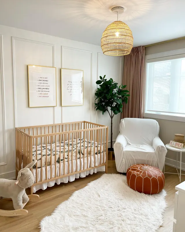 Nursery with panelled walls, a woven pendant and warm daylight.