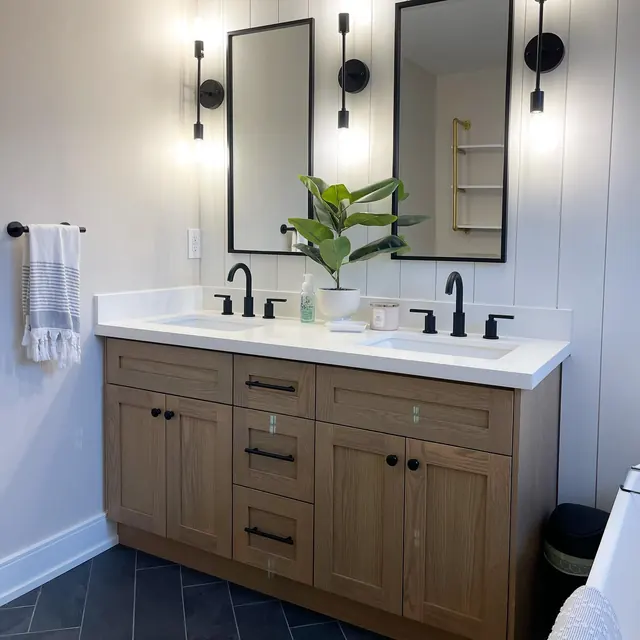 Double vanity with black tapware.